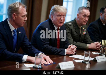 Washington, DC, USA. 03rd Apr, 2019. US President Donald J. Trump (C), with Acting Secretary of Defense Patrick Shanahan (L) and Chairman of the Joint Chiefs of Staff General Joseph Dunford (R), delivers remarks during a briefing by senior military leaders in the Cabinet Room of the White House in Washington, DC, USA, 03 April 2019. Following the briefing President Trump will host a dinner for the officials. Credit: Shawn Thew/Pool via CNP | usage worldwide Credit: dpa/Alamy Live News Stock Photo