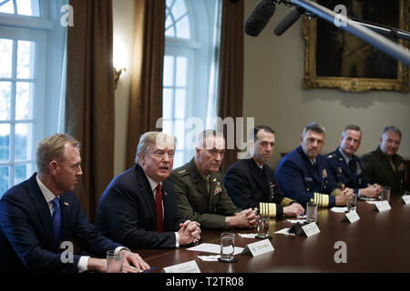 Washington, District of Columbia, USA. 3rd Apr, 2019. US President Donald J. Trump (L-2), with Acting Secretary of Defense Patrick Shanahan (L) and Chairman of the Joint Chiefs of Staff General Joseph Dunford (L-3), delivers remarks during a briefing by senior military leaders in the Cabinet Room of the White House in Washington, DC, USA, 03 April 2019. Following the briefing President Trump will host a dinner for the officials Credit: Shawn Thew/CNP/ZUMA Wire/Alamy Live News Stock Photo