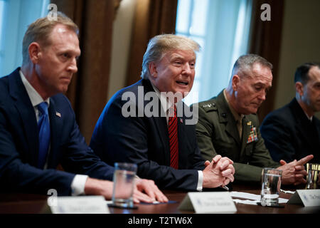 US President Donald J. Trump (C), with Acting Secretary of Defense Patrick Shanahan (L) and Chairman of the Joint Chiefs of Staff General Joseph Dunford (R), delivers remarks during a briefing by senior military leaders in the Cabinet Room of the White House in Washington, DC, USA, 03 April 2019. Following the briefing President Trump will host a dinner for the officials. Credit: Shawn Thew/Pool via CNP /MediaPunch Stock Photo
