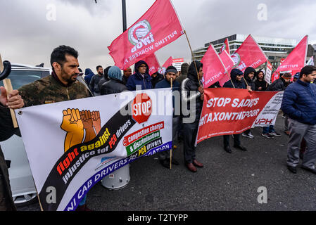 London, UK. 4th April 2019. Private hire drivers block London Bridge to protest against TfL making them pay the congestion charge from April 8th. They accuse TfL of discriminating against private hire drivers who are largely from Black, Asian and minority ethnic groups while black cabs, whose drivers are largely white are still exempt. Today the court decided their complaint would be heard in July, but refused an order to delay charging unti them. Credit: Peter Marshall/Alamy Live News Stock Photo