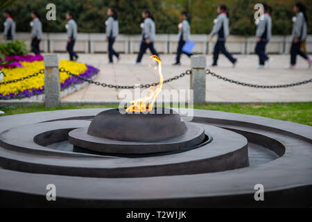 Beijing, China. 4th Apr, 2019. Students pay tribute to martyrs at Yuhuatai memorial park of martyrs in Nanjing, east China's Jiangsu Province, April 4, 2019, the eve of the Qingming Festival. It is a tradition for the Chinese people to pay respect to ancestors, deceased family members, and national heroes and martyrs at the Qingming Festival, a day for tomb sweeping. Credit: Su Yang/Xinhua/Alamy Live News Stock Photo