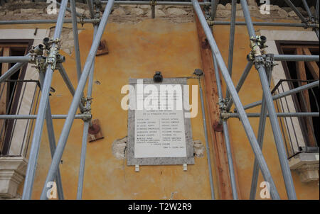 Onna, Italy. 02nd Apr, 2019. View of a house facade in the Italian Abruzzo village near L'Aquila, which was destroyed by a devastating earthquake ten years ago. A commemorative plaque commemorates the murder of 17 civilians by the German Wehrmacht in 1944, which is why the German government decided in 2009 to concentrate aid for the earthquake region on the village. (to dpa 'emptiness, destruction, grief - even ten years after the earthquake') Credit: Lena Klimkeit/dpa/Alamy Live News Stock Photo