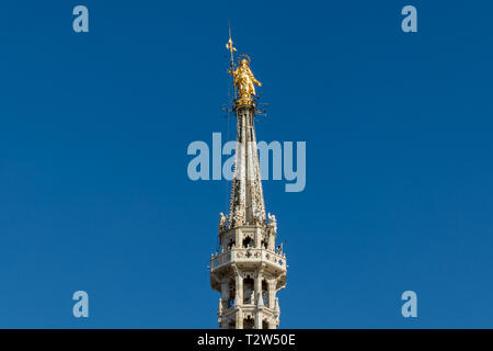 Golden statue of Virgin Mary, placed at the rooftop of Duomo cathedral in Milan, Italy Stock Photo