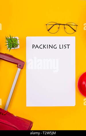 The Packing List For The Trip Is Next To A Suitcase A Cup Of Coffee And A Straw Summer Bag On A Yellow Background Getting Ready For A Travel Concept Stock Photo
