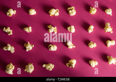 top view food fashion flat lay popcorn on a pink background Stock Photo