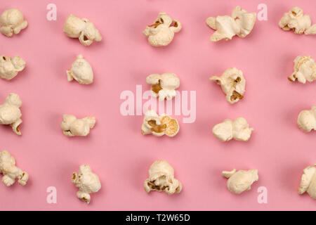 top view food fashion flat lay popcorn on a pink background Stock Photo