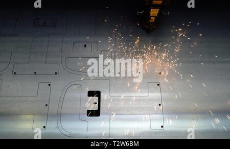 laser cutting of metal sheets in a metal construction company Stock Photo