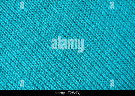 Texture of Turquoise Blue Colored Alpaca Knitted Wool Fabric in Diagonal Patterns Stock Photo