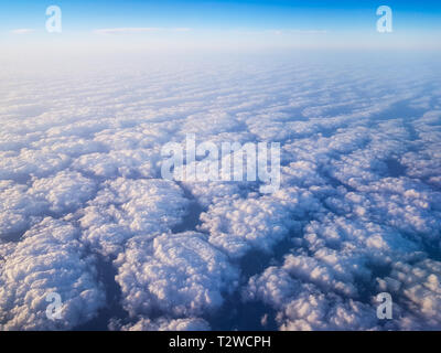 Clouds seen from above from an airplane cabin Stock Photo