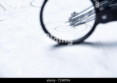 Compass on the background detail drawings. The part of architectural project. selective focus Stock Photo