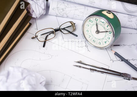 Several drawings and tools for drawing on the table in the engineer. The part of architectural project. selective focus Stock Photo