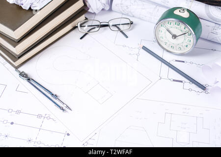 Several drawings and tools for drawing on the table in the engineer. Engineering and technology. Technical drawing. selective focus Stock Photo