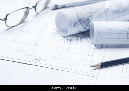 Rolls of drawings with eyepieces in the background. Architectural blueprints and blueprint rolls. selective focus Stock Photo