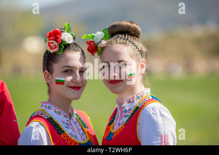 VARVARA, BULGARIA - MARCH 24, 2019: Moment from National Festival Dervish Varvara presents traditions of Bulgarian Kuker Games. Two girls in folklore  Stock Photo