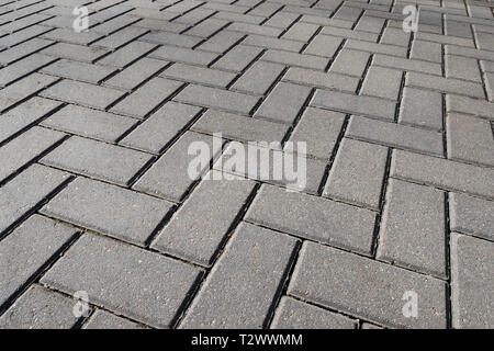 Texture of road tiles with herringbone pattern. Stock Photo