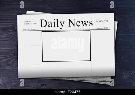 pack of Daily News newspapers with copy space on dark table background Stock Photo