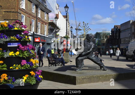 The Lino Men Sculpture in the High Street of Staines upon Thames in Surrey Uk Stock Photo