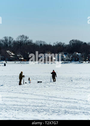 Ice fishing on Monona Bay, Madison, Wisconsin, USA. Stock Photo