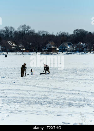 Ice fishing on Monona Bay, Madison, Wisconsin, USA. Stock Photo