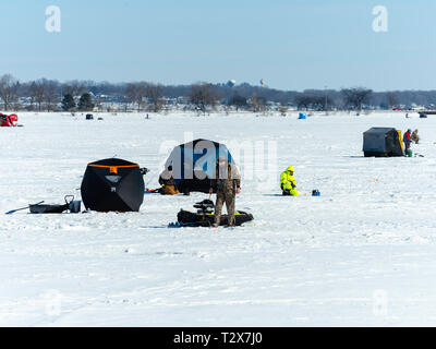 Ice fishing on Monona Bay, Madison, Wisconsin, USA. Stock Photo