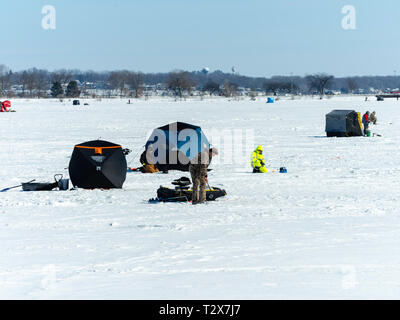 Ice fishing on Monona Bay, Madison, Wisconsin, USA. Stock Photo