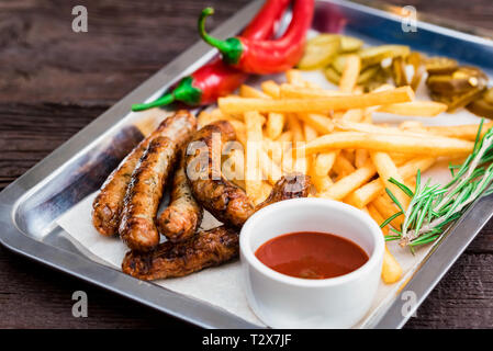 Close-up tray with big breakfast with sausage. Selective focus Stock Photo