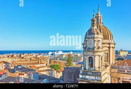 Mediterranean sea  and panorama of the old town of Catania with towers of Saint Agatha Cathedral, Sicily, Italy. Copyspace composition Stock Photo