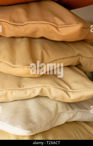 Ochre decorative pillows made from real leather Stock Photo