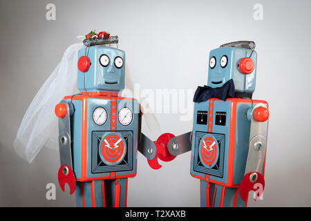 Close up of toy robots getting married Stock Photo