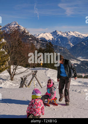 children with sledge, skiing area Hochimst, Imst, Tyrol, Austria, Europe Stock Photo