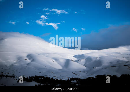 This is a capture for a landscape during winter in north Lebanon and you can see the snow cover the huge mountains Stock Photo