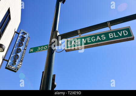 A neon sign in daylight for Zappos on Las Vegas Boulavard in downtown Las Vegas Stock Photo