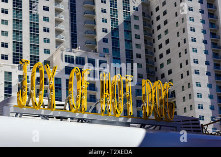 A restaurant neon sign that says, Joy of Hot Dog in downtown Las Vegas Stock Photo