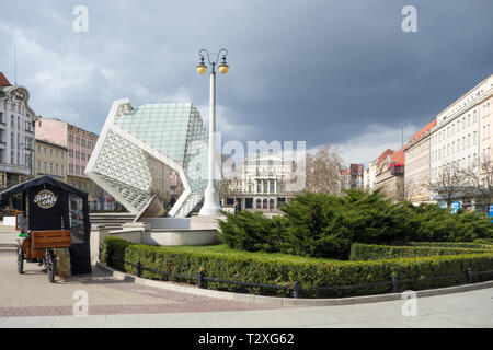 The Arkadia building a former theater now a book store and tourist information office and the freedom fountain standing in freedom square Poznan Stock Photo