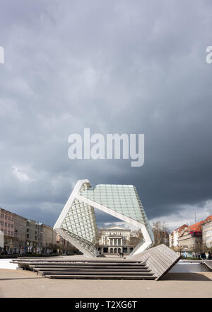 The Arkadia building a former theater now a book store and tourist information office seen through the Freedom fountain across freedom square Poznan Stock Photo