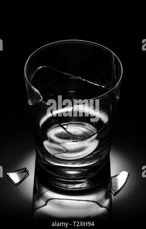 Fallen broken glass on black background. Damage concept Stock Photo