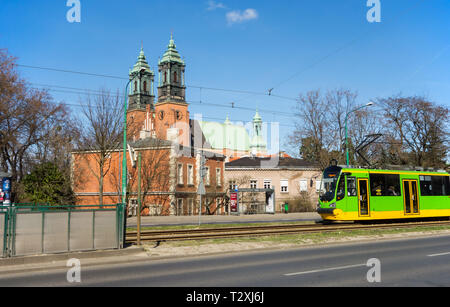 Tram passing the cathedral of St Peter and St Paul in the Polish city of Poznan Poland Stock Photo