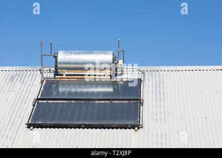 Roof mounted, rooftop, domestic solar hot water geyser with photovoltaic  panels and convertor, renewable, sustainable, alternative, eco-friendly  energ Stock Photo - Alamy