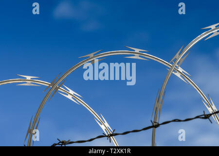 LAS VEGAS, NEVADA, USA - FEBRUARY 2019: Close up of coils of razor wire on a security fence around McCarran International Airport in Las Vegas.