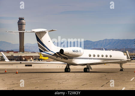 LAS VEGAS, NEVADA, USA - FEBRUARY 2019: Gulfstream V private executive jet parked at McCarran International Airport in Las Vegas. In the background is Stock Photo