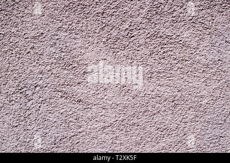 light-pink painted relief wall. background, texture. Stock Photo