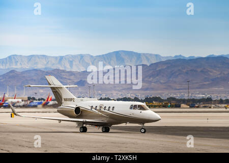 LAS VEGAS, NEVADA, USA - FEBRUARY 2019: Hawker 800 private executive jet taxiing after landing at McCarran International Airport in Las Vegas.
