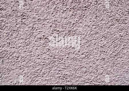 light-pink painted relief wall. background, texture. Stock Photo
