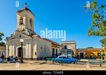 Center square of Cuban town with church Iglesia San Francisco de Paula, Trinidad, Cuba Stock Photo