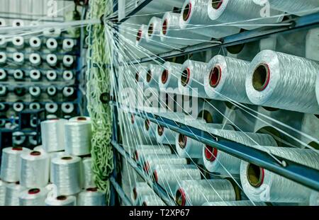 Cotton Yarnrolls, plying yarn, textile factory producing cotton fabrics, Istanbul Stock Photo