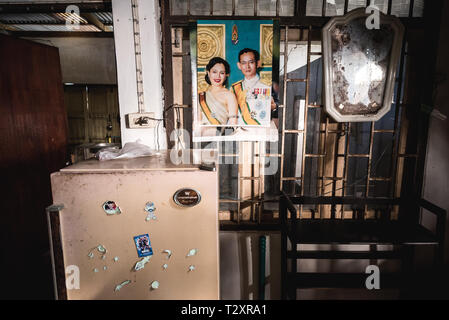 Ubon Ratchathani, Thailand - February 11, 2017: an interior of Thai house with portrait of King Rama IX and Queen Sirikit on wall. Stock Photo