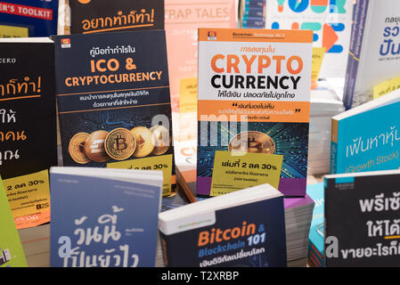 Bangkok, Thailand - October 4, 2018: books on crypto currency, bitcoin and blockchain technology in Thai language on a shop shelf of a bookstore. Stock Photo