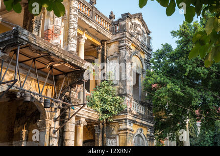 Exterior of the Mansion or Villa Bodega, a half-ruined colonial-era building (1910-1920s) in Phnom Penh city center, Cambodia. February 2019. Stock Photo