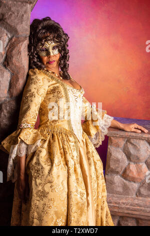 A middle aged, Puerto Rican, woman at a masquerade party. Stock Photo