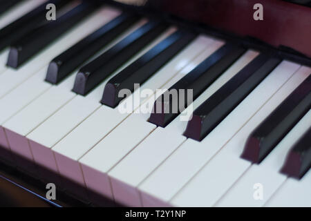 Classical piano keyboard black and withe, musical keys and instrument. Music concept background. Close up, selective focus Stock Photo